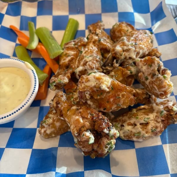 Tipsy Tequila and Taco Bar's chicken wings with creamy sauce, carrots, celery, and dipping sauce.